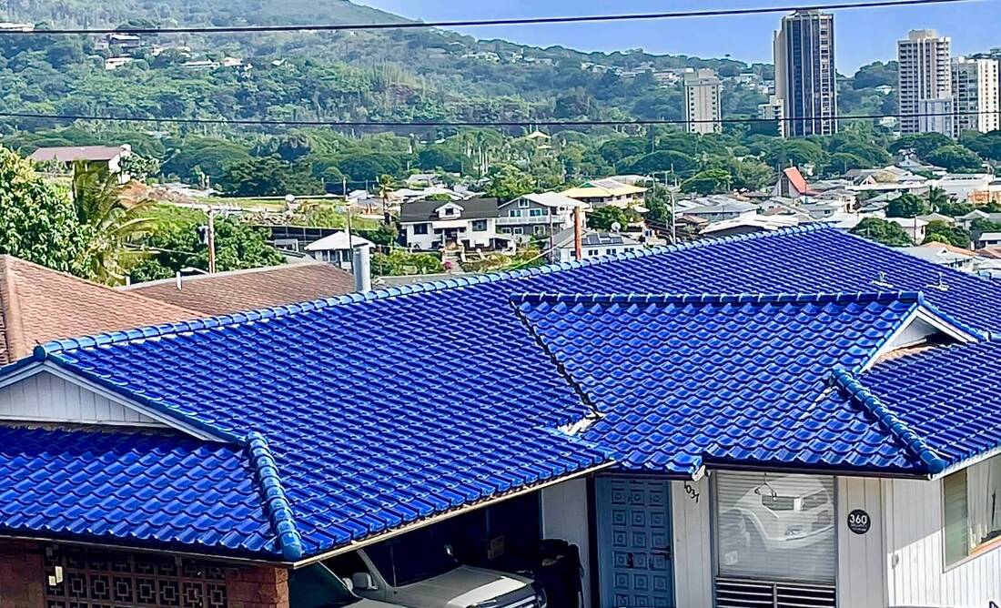 Blue tiled roof on white house